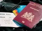 Praca za granicą - paszport i bilet na zdjęciu