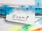 Kartka w notesie z napisem exam
