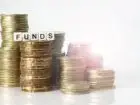 Fundusz Kościelny - stosy monet z podpisem funds