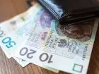 Polskie banknoty wystające z portfela