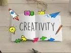Kreatywne CV - napis creativity w zeszycie, wokół kolorowe ikony