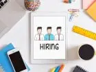 Praca Kwidzyń - napis hiring na tablecie