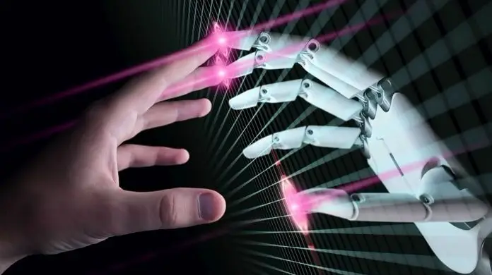 Google zwalnia roboty - stykające się palcami dłonie człowieka i robota