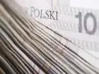Dodatek do emerytury 230 zł - zdjęcie przedstawiające banknoty 100 zł