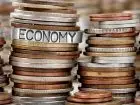 Brzoska deregulacje jakie - stosy monet, a na nich napis economy
