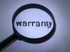 Gwarancja - lupa na napis warranty, czyli gwarancja po angielsku