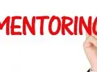 Mentor - czerwony napis mentoring na białym tle