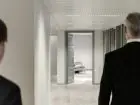 Onboarding - jeden pracownik oprowadzający drugiego po korytarzu