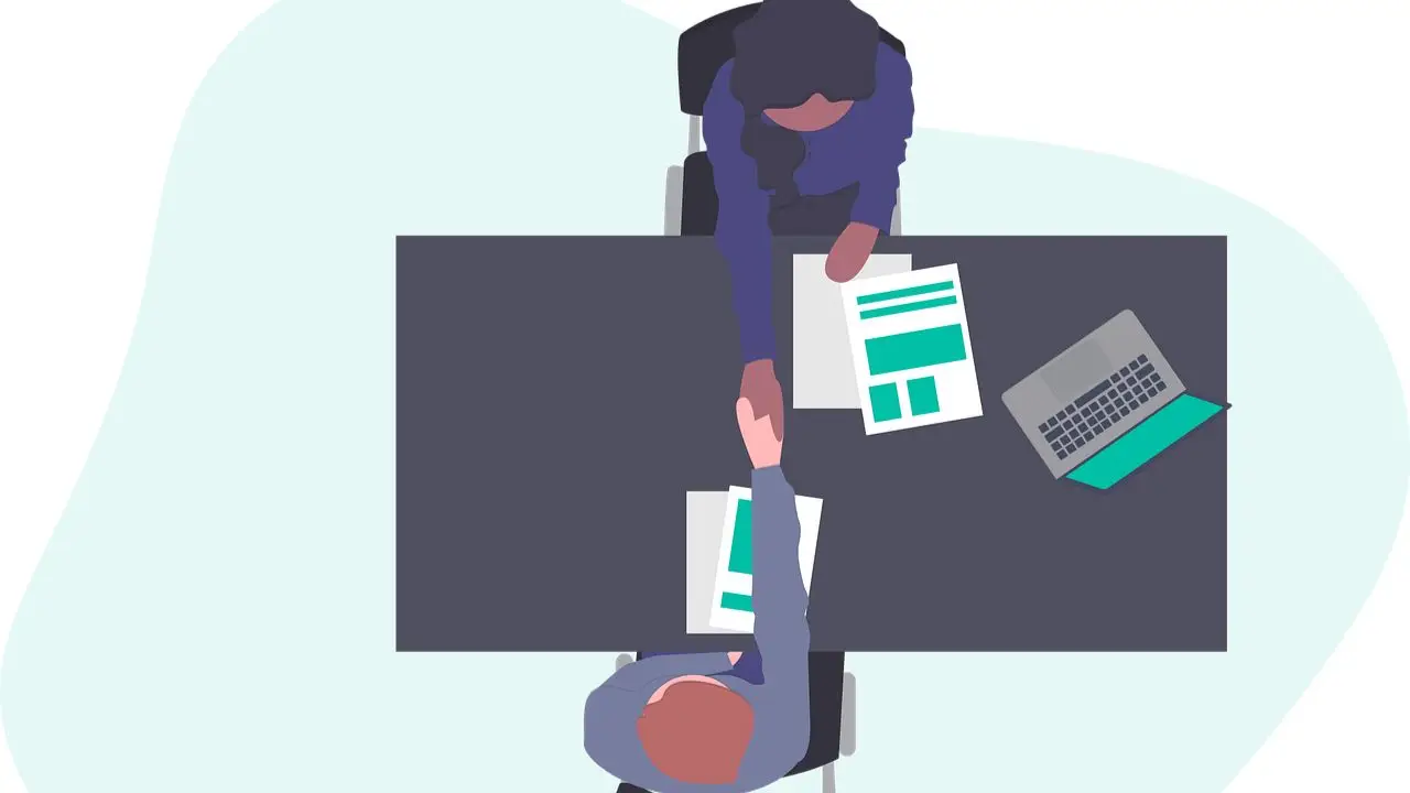 Rozmowa o pracę - podanie dłoni przez rekrutera i kandydata