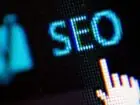 Pozycjonowanie Łódź - napis SEO na ekranie