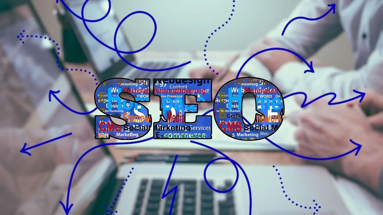 Pozycjonowanie Wrocław - napis SEO na tle komputera